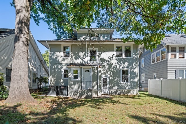 rear view of house with a lawn