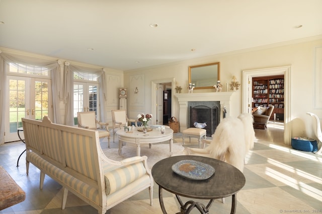 living room featuring french doors, plenty of natural light, crown molding, and light wood-type flooring