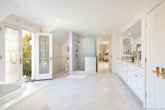 full bathroom featuring toilet, vanity, plus walk in shower, and ornamental molding