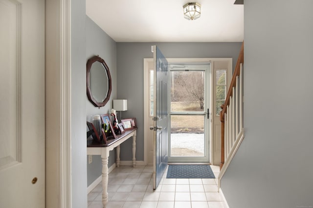 entryway with light tile patterned floors