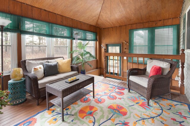 sunroom featuring wooden ceiling and lofted ceiling