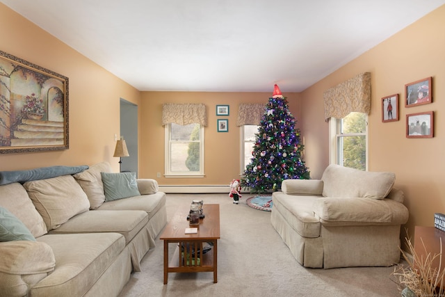 carpeted living room featuring plenty of natural light and a baseboard heating unit