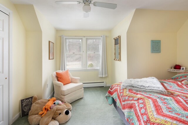 bedroom with ceiling fan, a closet, carpet, and a baseboard radiator