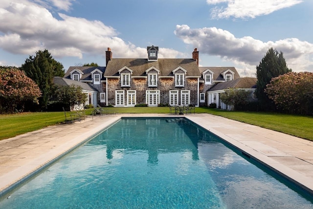 10 N Beaver Dam Rd, Salisbury, CT 06068 - back of house with a lawn, french doors, an outdoor pool, and a chimney