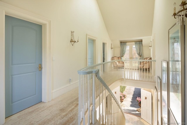 10 N Beaver Dam Rd, Salisbury, CT 06068 - hall featuring wood finished floors, an upstairs landing, and high vaulted ceiling