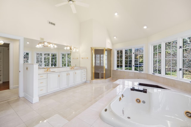 bathroom with vanity, high vaulted ceiling, tile patterned floors, ceiling fan with notable chandelier, and separate shower and tub