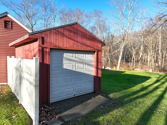 garage featuring a lawn