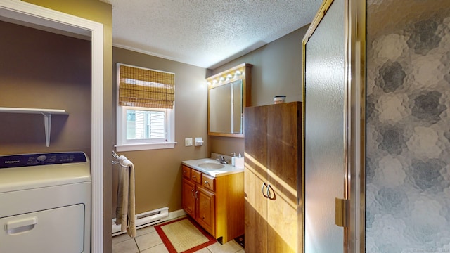 bathroom featuring walk in shower, baseboard heating, tile patterned flooring, a textured ceiling, and washer / dryer