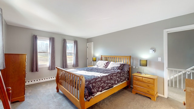 carpeted bedroom with baseboard heating