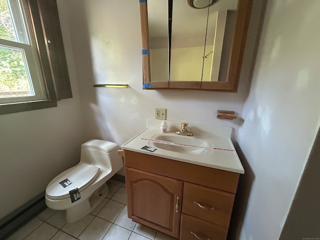 bathroom featuring tile patterned flooring, vanity, and toilet