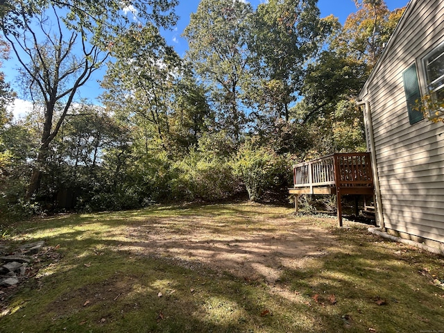 view of yard featuring a wooden deck