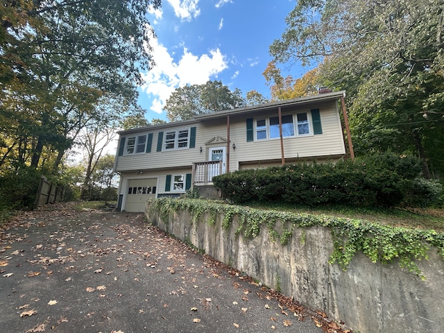 split foyer home featuring a garage