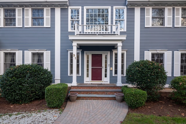 entrance to property featuring a balcony