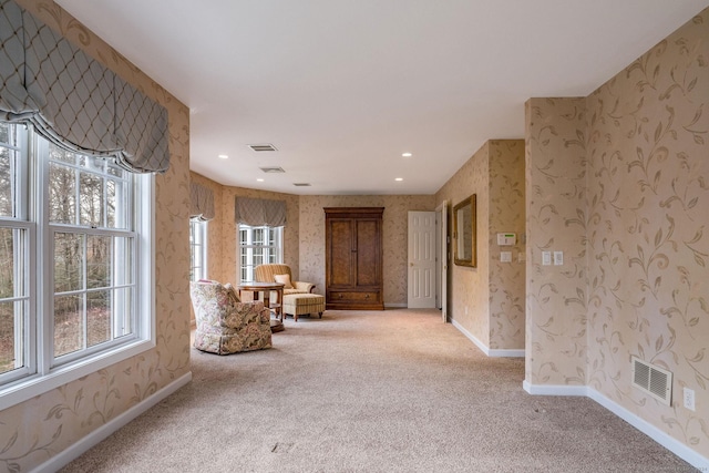 unfurnished room with light carpet