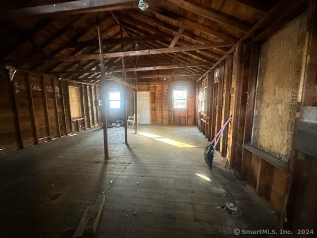 miscellaneous room featuring lofted ceiling