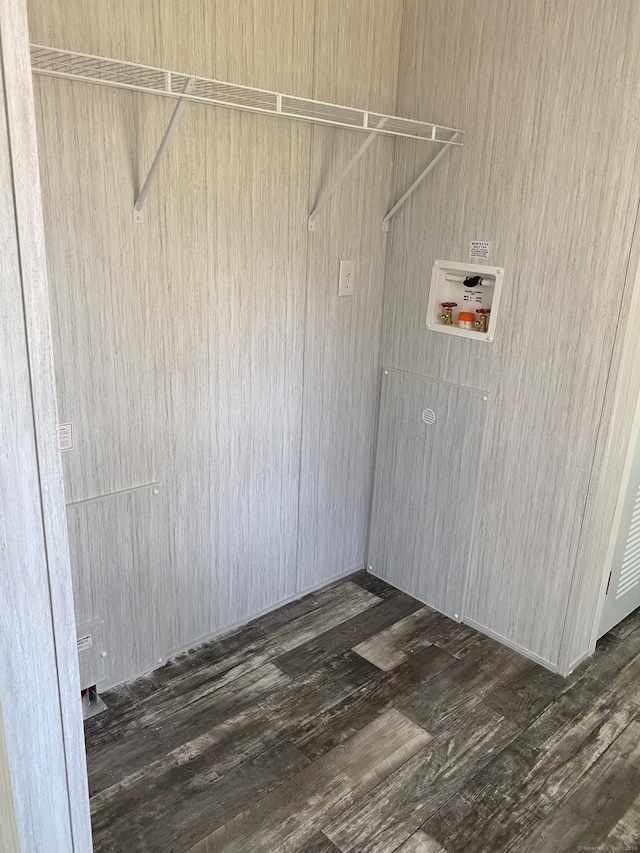 laundry area featuring dark hardwood / wood-style flooring and hookup for a washing machine