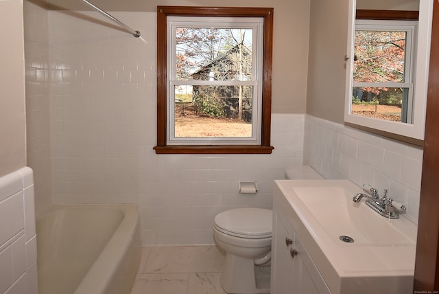 full bathroom featuring vanity, toilet, tile walls, and independent shower and bath