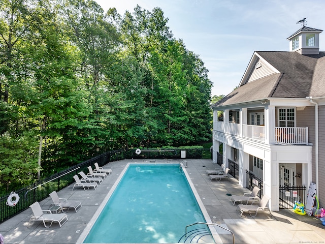 view of swimming pool with a patio area