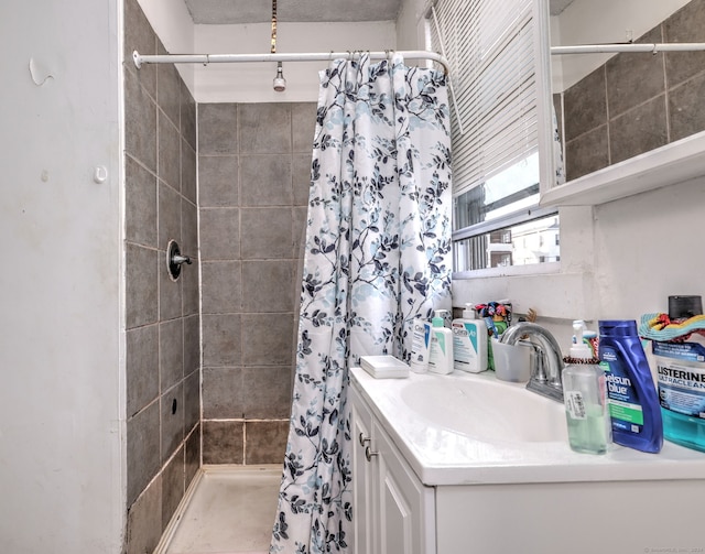 bathroom featuring vanity and walk in shower