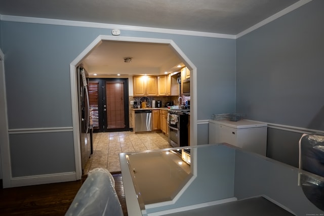 kitchen featuring ornamental molding, tasteful backsplash, light hardwood / wood-style floors, and stainless steel appliances