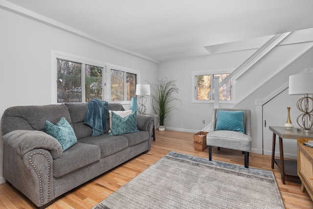 living area with wood finished floors and baseboards