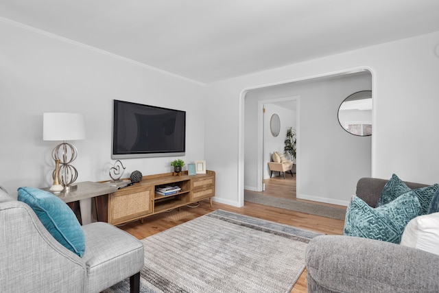 living room featuring wood finished floors and baseboards