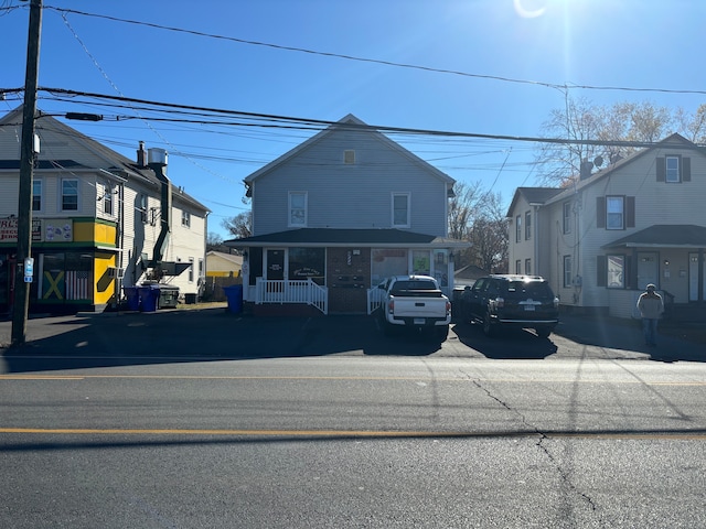 view of front property featuring covered porch