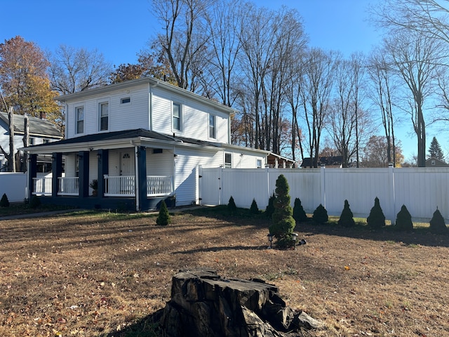 view of side of home with a porch