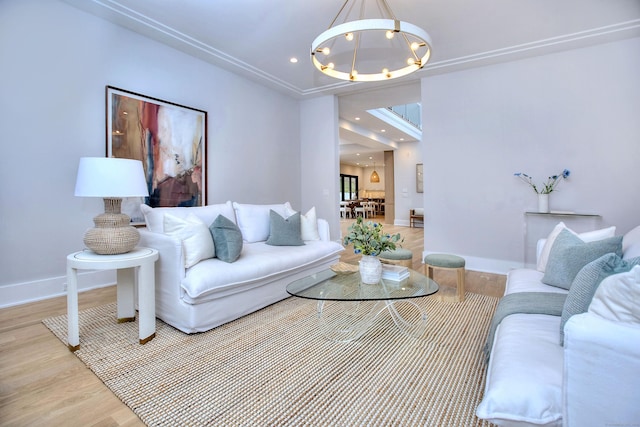 living room featuring wood-type flooring and a chandelier