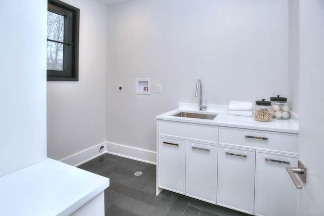 laundry room with washer hookup, sink, cabinets, and hookup for an electric dryer