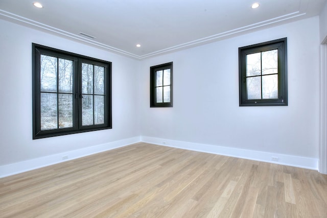 spare room with light hardwood / wood-style floors