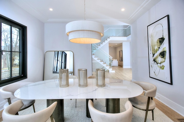 dining area with light hardwood / wood-style floors