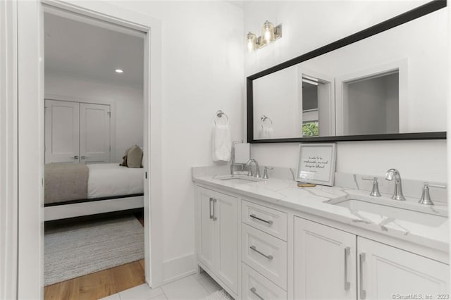 bathroom featuring vanity and wood-type flooring