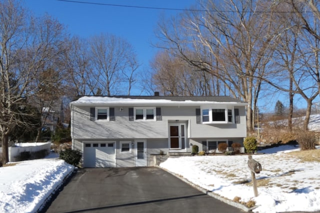 split foyer home featuring a garage