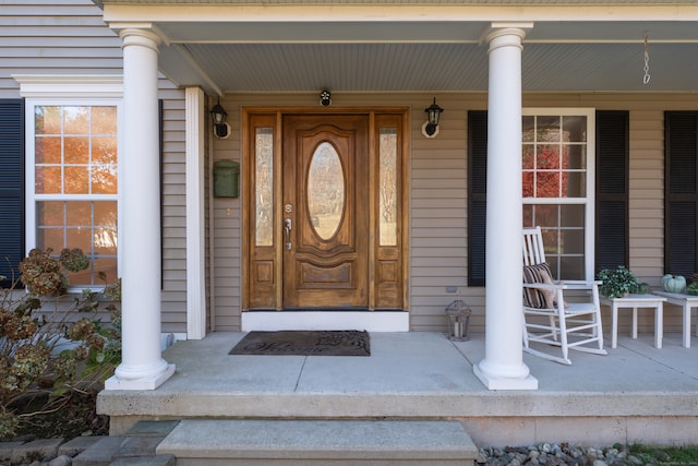 doorway to property with a porch