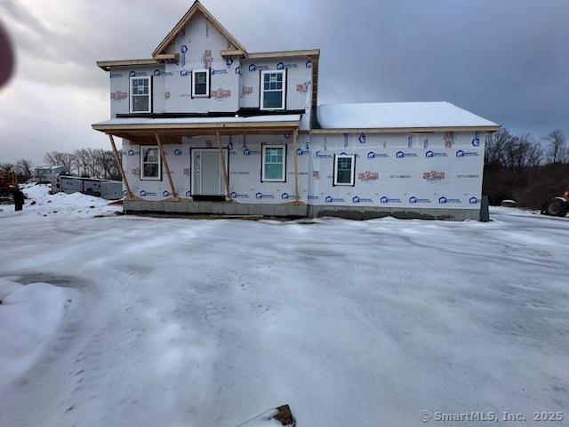 property in mid-construction featuring covered porch