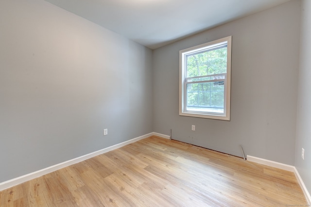 empty room with light wood-type flooring