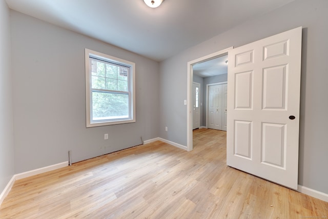 spare room featuring light hardwood / wood-style flooring