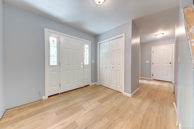 entryway with light hardwood / wood-style floors