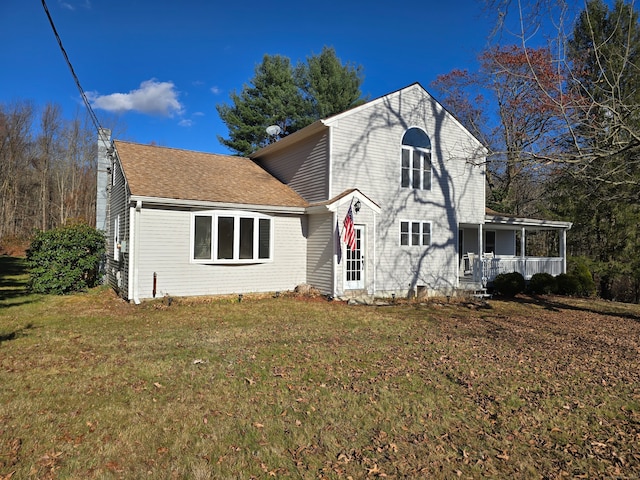 view of front of house featuring a porch and a front yard