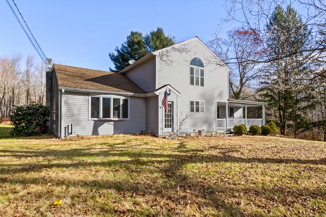 exterior space with a lawn and covered porch