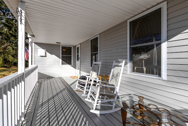 wooden terrace with a porch