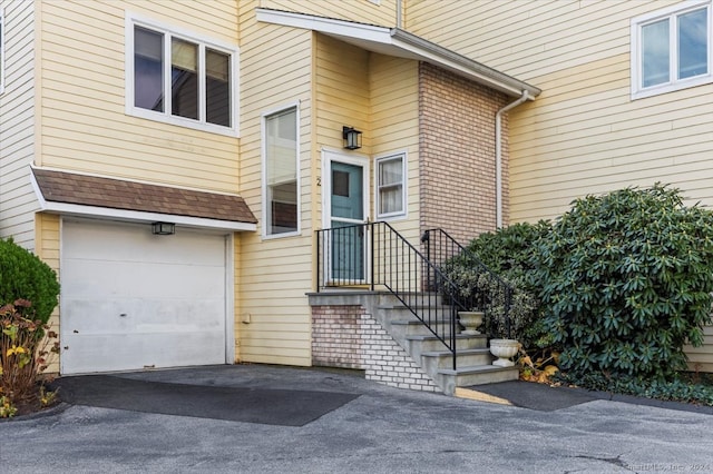 property entrance with a garage