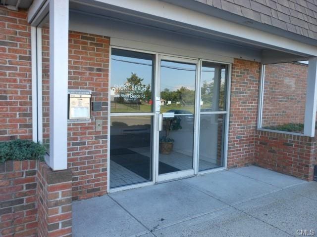 property entrance with a patio area