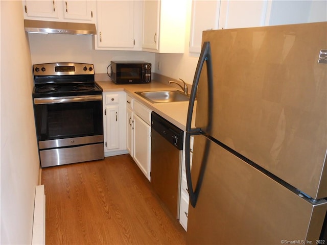 kitchen featuring stainless steel appliances, white cabinetry, sink, and light hardwood / wood-style flooring