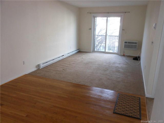 carpeted empty room featuring a baseboard radiator and a wall mounted AC