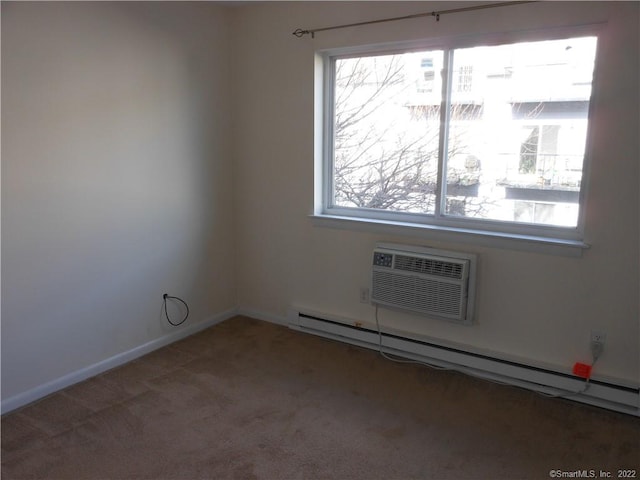 carpeted empty room with a healthy amount of sunlight, a wall unit AC, and baseboard heating