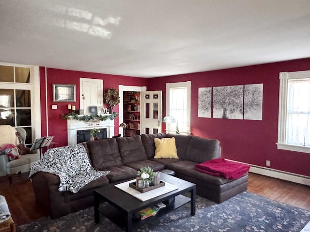 living room with a wealth of natural light and hardwood / wood-style floors