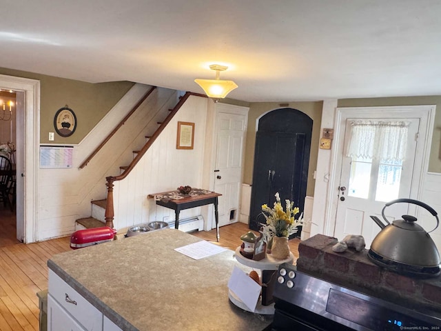 373 Main St, New Hartford, CT 06057 - living room featuring light wood-type flooring, stairway, and baseboard heating