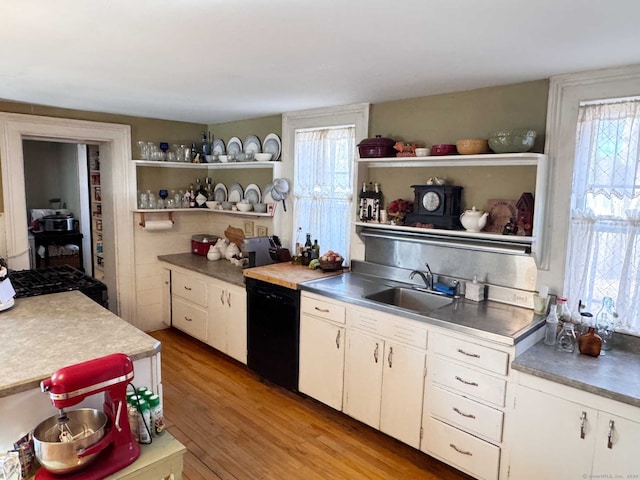 373 Main St, New Hartford, CT 06057 - kitchen featuring open shelves, a sink, dishwasher, stainless steel counters, and light wood-style flooring